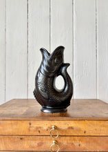 Load image into Gallery viewer, A black Dartmouth Pottery gluggle or gurgle jug