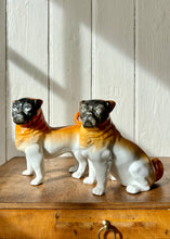 Load image into Gallery viewer, A pair of decorative ceramic pugs