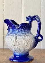 Load image into Gallery viewer, Blue graduated Neptune 'mask' jug with fish handle
