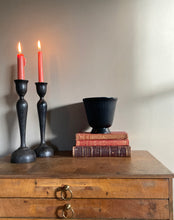 Load image into Gallery viewer, An elegant pair of black vintage hardwood Art Nouveau style candlesticks