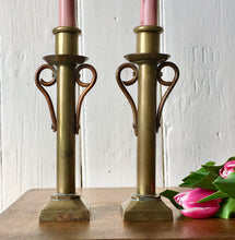 Load image into Gallery viewer, Pair of brass candlesticks with copper scrolls