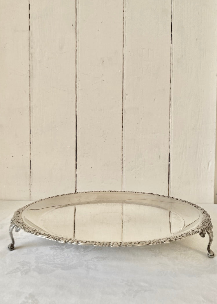 Circular engraved drinks tray with three ball and claw legs