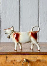 Load image into Gallery viewer, Vintage brown and white cow creamer/milk jug with bell
