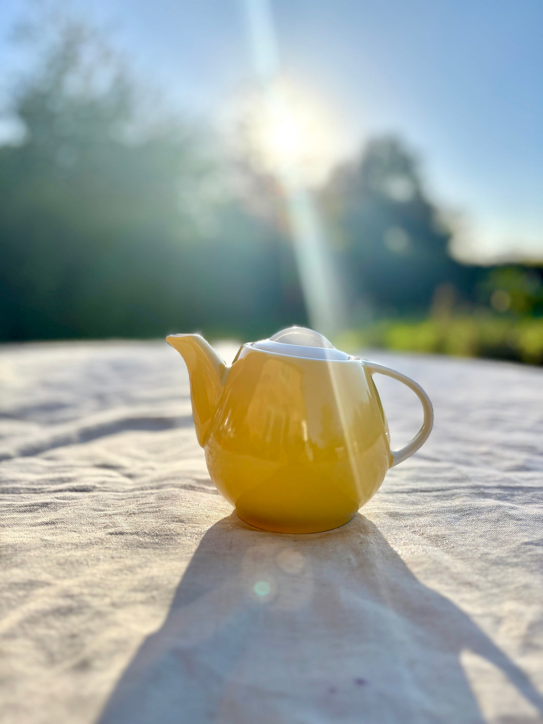 A one-cup yellow teapot