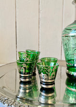 Load image into Gallery viewer, A green glass, silver embossed Venetian decanter and six shot glasses
