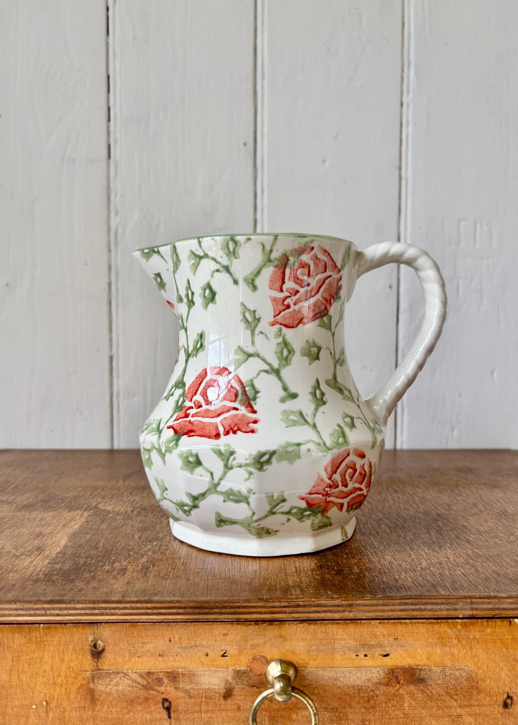 A Clay Craft spongeware jug with pink roses