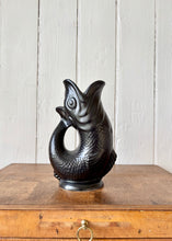Load image into Gallery viewer, A black Dartmouth Pottery gluggle or gurgle jug
