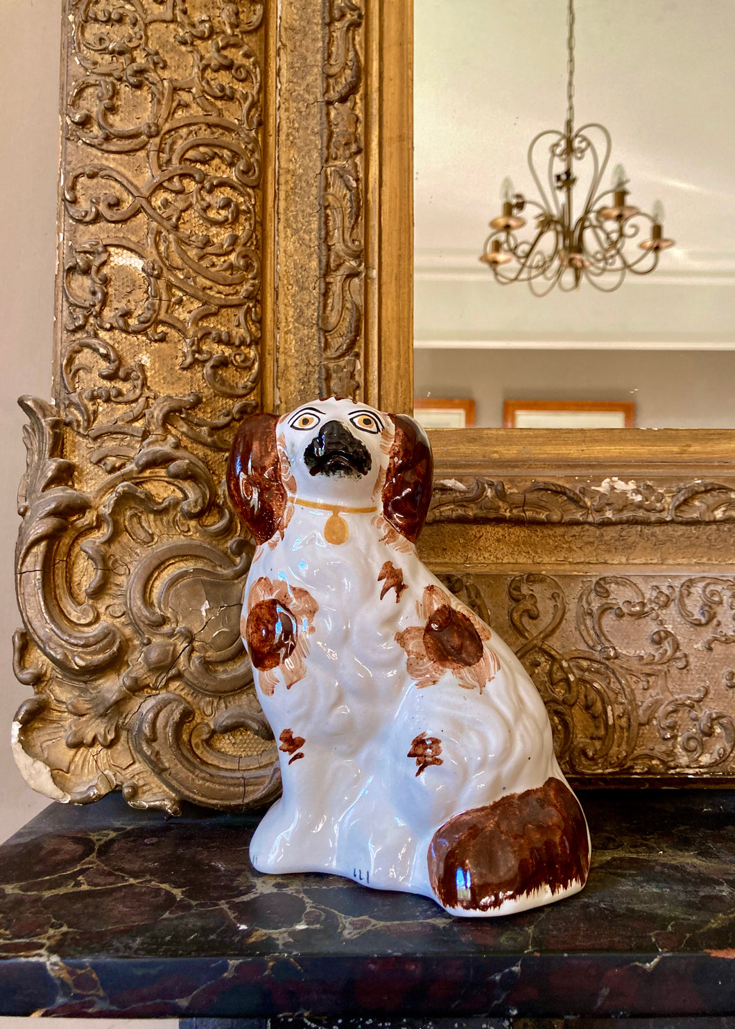 A hand painted Staffordshire mantle dog