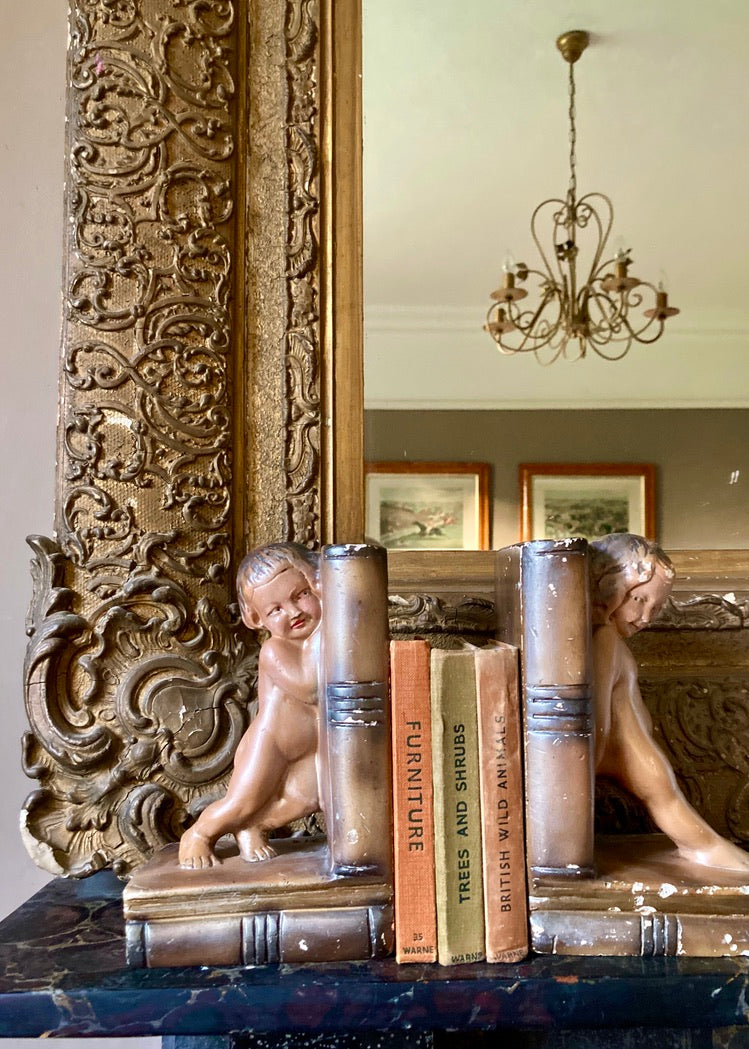 A rare pair of antique bronzed plaster bookends