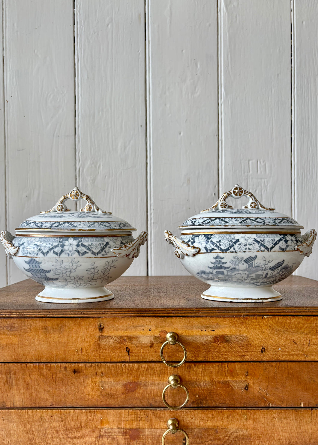 Grey and white transfer ware lidded tureens in oriental style with gilt trim