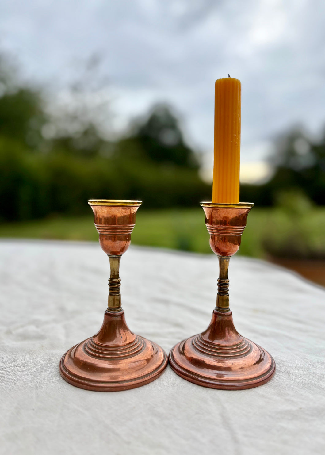 Pair of copper and brass candlesticks