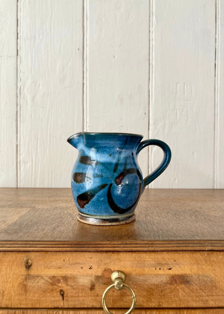 A pretty blue glazed studio pottery jug