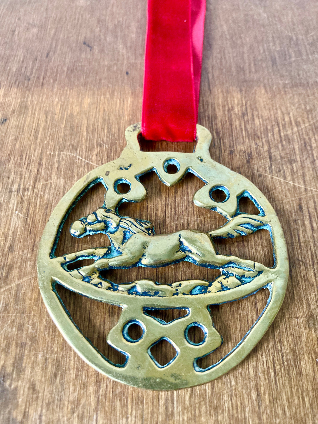 Galloping horse brass decoration