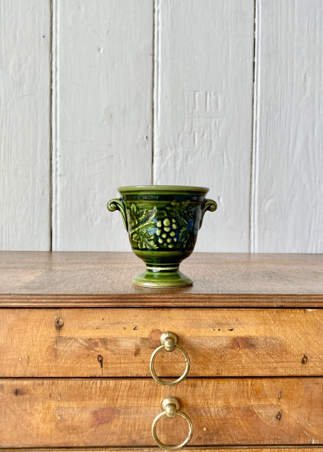 Holkham Pottery green mini urn -vines and grapes and twin handles