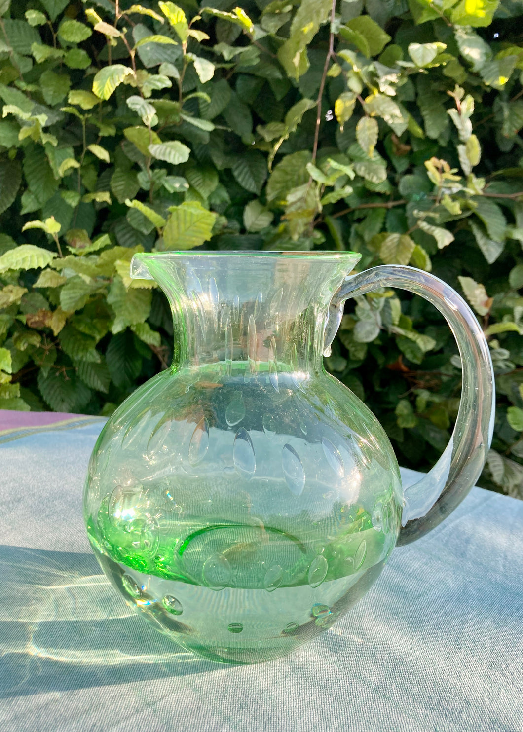 Pale green hand blown bubble glass water jug