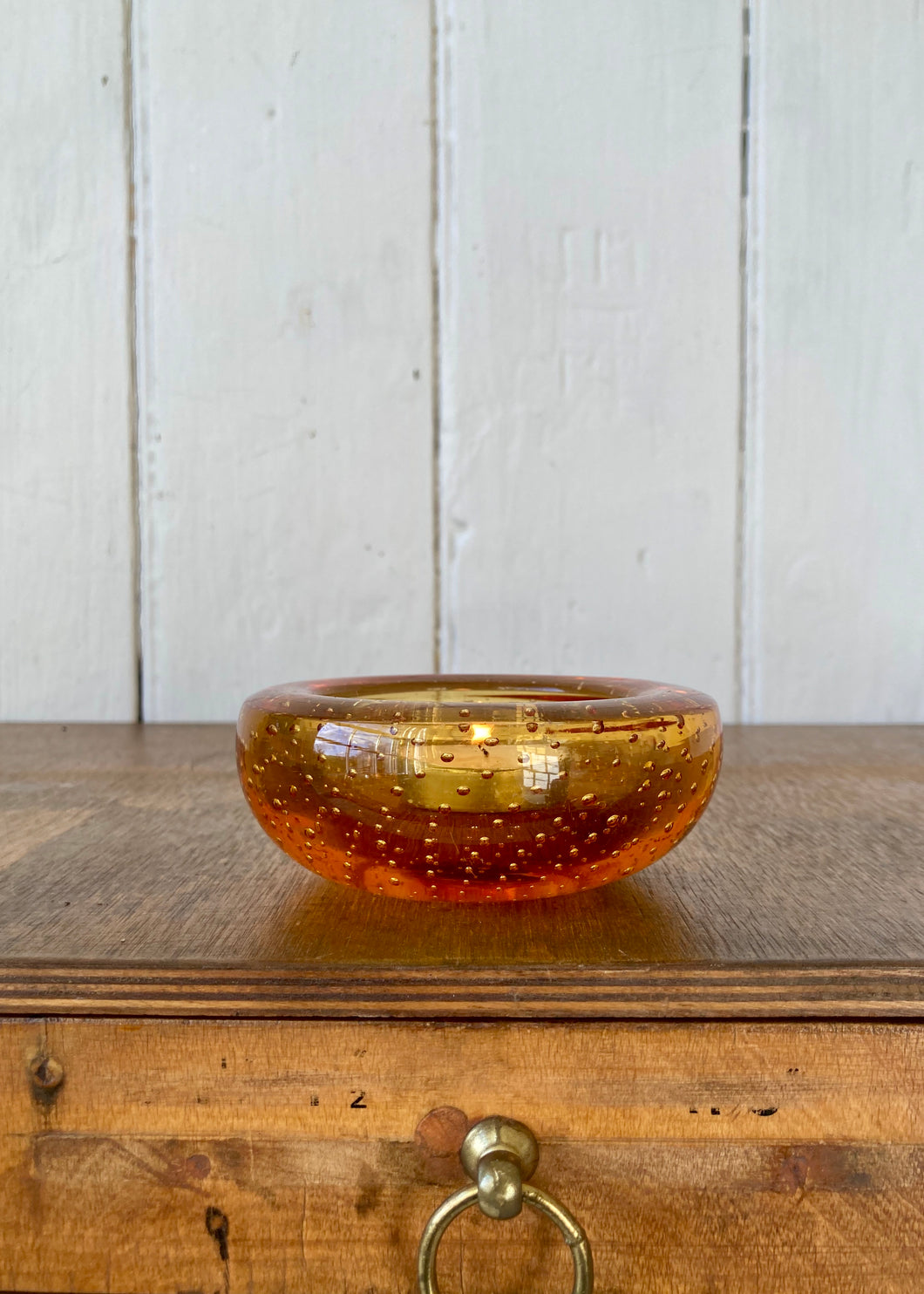 Amber bubble glass tea light holder.