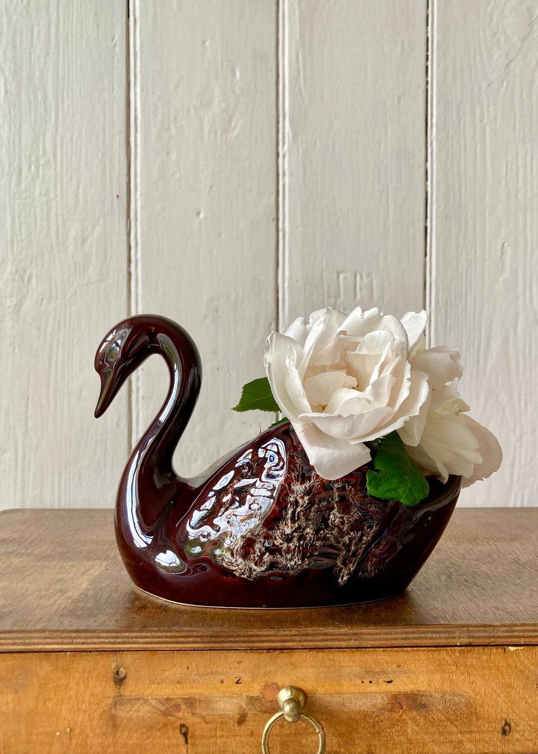 A treacle glaze swan vase by Kernewek Pottery, Cornwall.