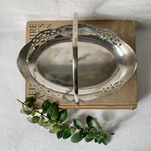 Load image into Gallery viewer, Decorative oval silver plate serving dish with hinged handle and cut-outs
