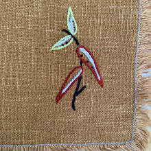 Load image into Gallery viewer, Hand embroidered, folk art style linen placemat with fringed edge.
