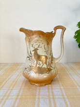 Load image into Gallery viewer, Blush and gilt jug with stag illustration
