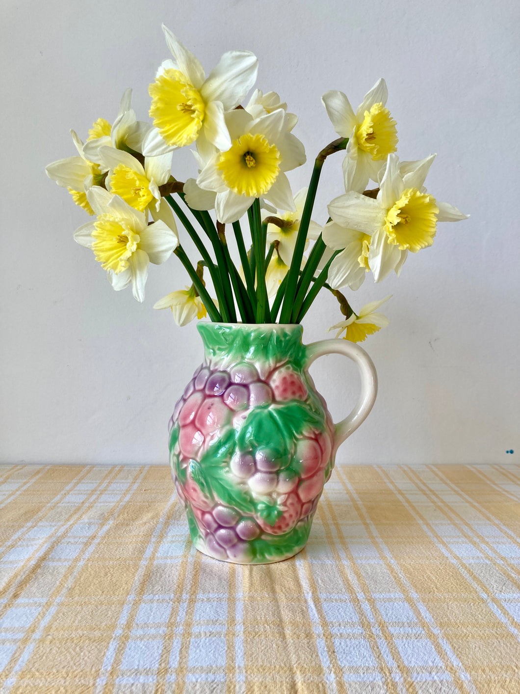 Fruity majolica jug with grapes and strawberries