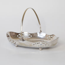 Load image into Gallery viewer, Decorative oval silver plate serving dish with hinged handle and cut-outs
